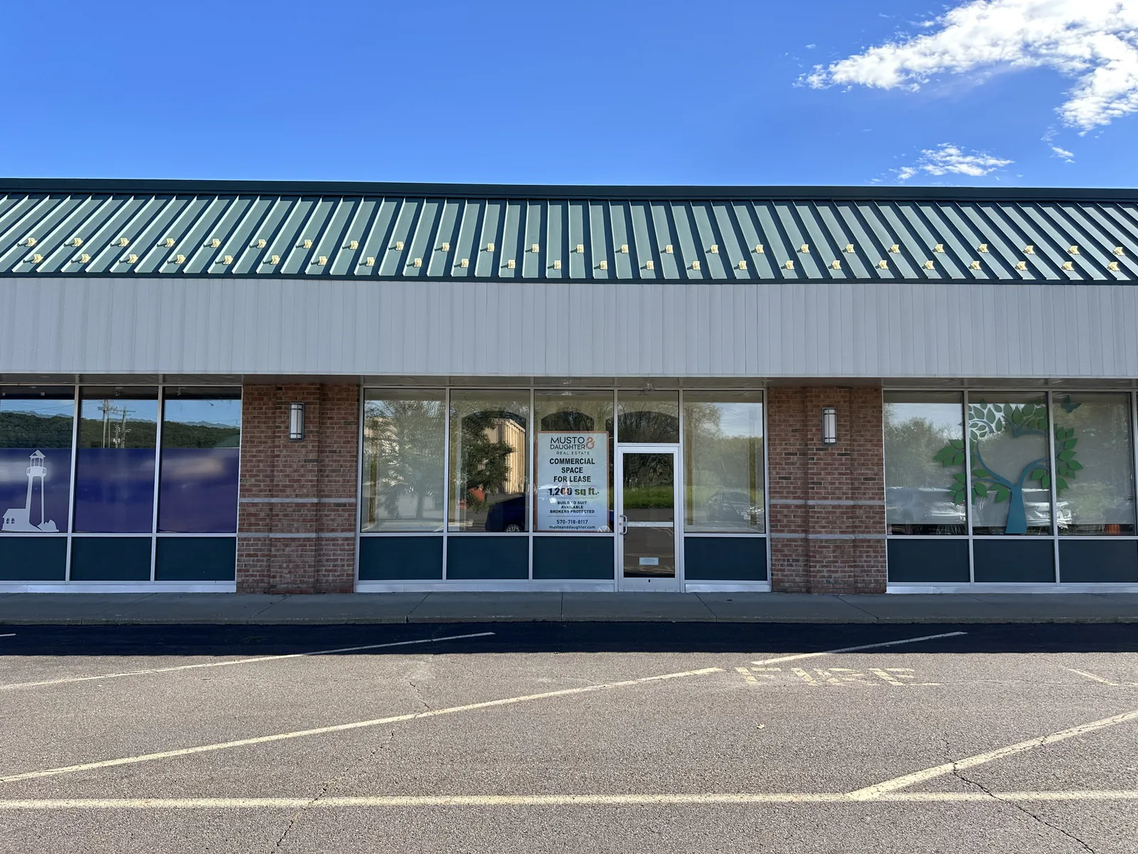 113 Gateway Shopping Center storefront with leasing sign